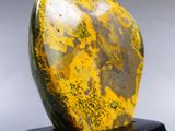 marble sculpture of a yellow and black stone on a black marble base
