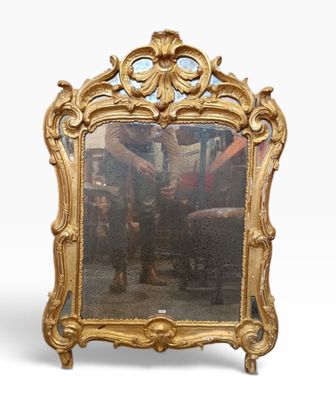 an antique mirror with a gold frame on a white background