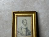 a picture of a picture of a woman in a gold frame
