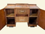 an image of a wooden cabinet with two doors open