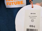 a label that says from future on the back of a blue sweater