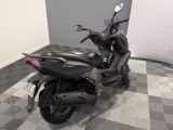 a motorcycle that is parked on a checkered floor