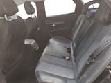 the back seats of a car are black and grey in color