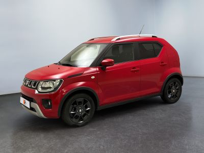 a red car is parked in a room with a white wall