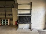 a room that has a shelf and a chair in it