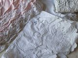 a pile of clothing and a pair of scissors on a table