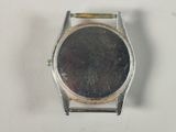 a watch that is sitting on a white surface