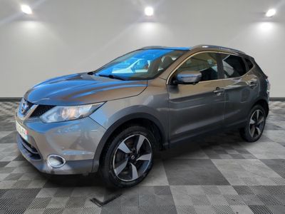 a silver nissan qx sport suv parked on a checkered floor
