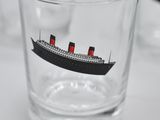 a glass with a picture of a ship on it