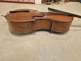 a violin that is sitting on the floor in the room