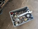 a box of tools sitting on the ground next to a motorcycle
