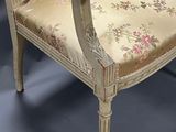 two chairs that are sitting next to each other