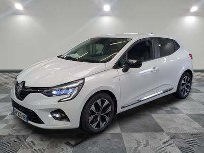 a white car parked in a room with a checkered floor