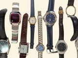 many different types of watches on display in a row