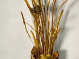 a vase that has some flowers in it on a table