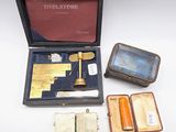 a box with a pen, a book, and other items in it