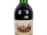 a bottle of wine that is sitting on a table