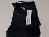 the jeans are black and have a white tag on them