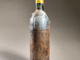 a bottle of wine that is sitting on a table