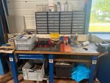 a workbench with a lot of tools on it