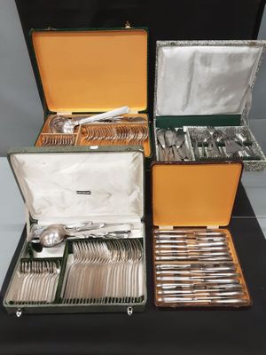 a lot of silverware in a case on a table
