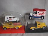 three toy cars in a display case on a table