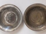 pair of antique silver plated bowls on white background