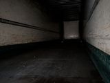 graffiti on the wall of a building in a dark room
