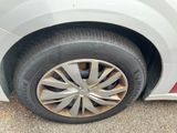 a close up of a tire on a white car