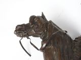 a statue of a horse with a bridle on it ' s head