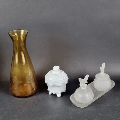 three vases that are next to each other on a table