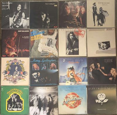 a lot of records on the floor of this room