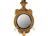 une image représentant un miroir doré orné d'un aigle