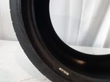 a close up of a tire tire on a white surface