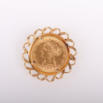 une image représentant une pièce d'or sur laquelle figure la tête d'une femme