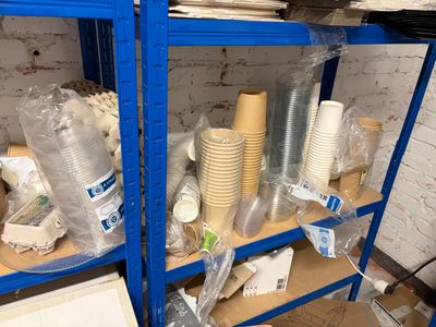 a shelf with many different types of cups and cups on it