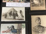 several old photos of men and women are displayed on a table