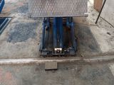 an image of a truck bed being worked on in a garage