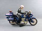 a figurine of a man on a motorcycle with a helmet on
