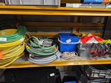 many different types of hoses on the shelves