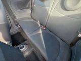 the back seats of a car are black and grey in color