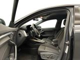 the interior of a car with the door open and the driver ' s seat down