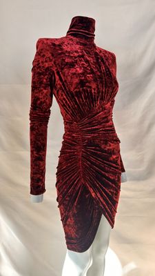 a red velvet dress on a mannequin mannequin mannequin mannequin mannequin mannequin mannequin mannequin manne
