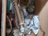 a cardboard box filled with assorted items in it