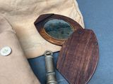 a bag with a wooden object and a metal object