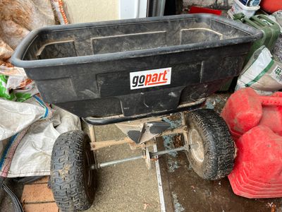 a black cart with a sign on the side of it