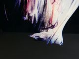 a close up picture of a woman ' s face with long hair