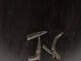 an image of a bronze sculpture of a bird on a branch