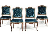 four chairs with blue velvet upholstered seats and gold trim