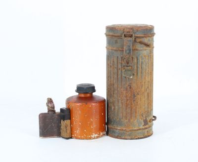 two old tins and a canister on a white surface